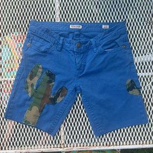 Upcycled Mek Denim royal blue cutoff shorts with embroidered camo cactus sz 28